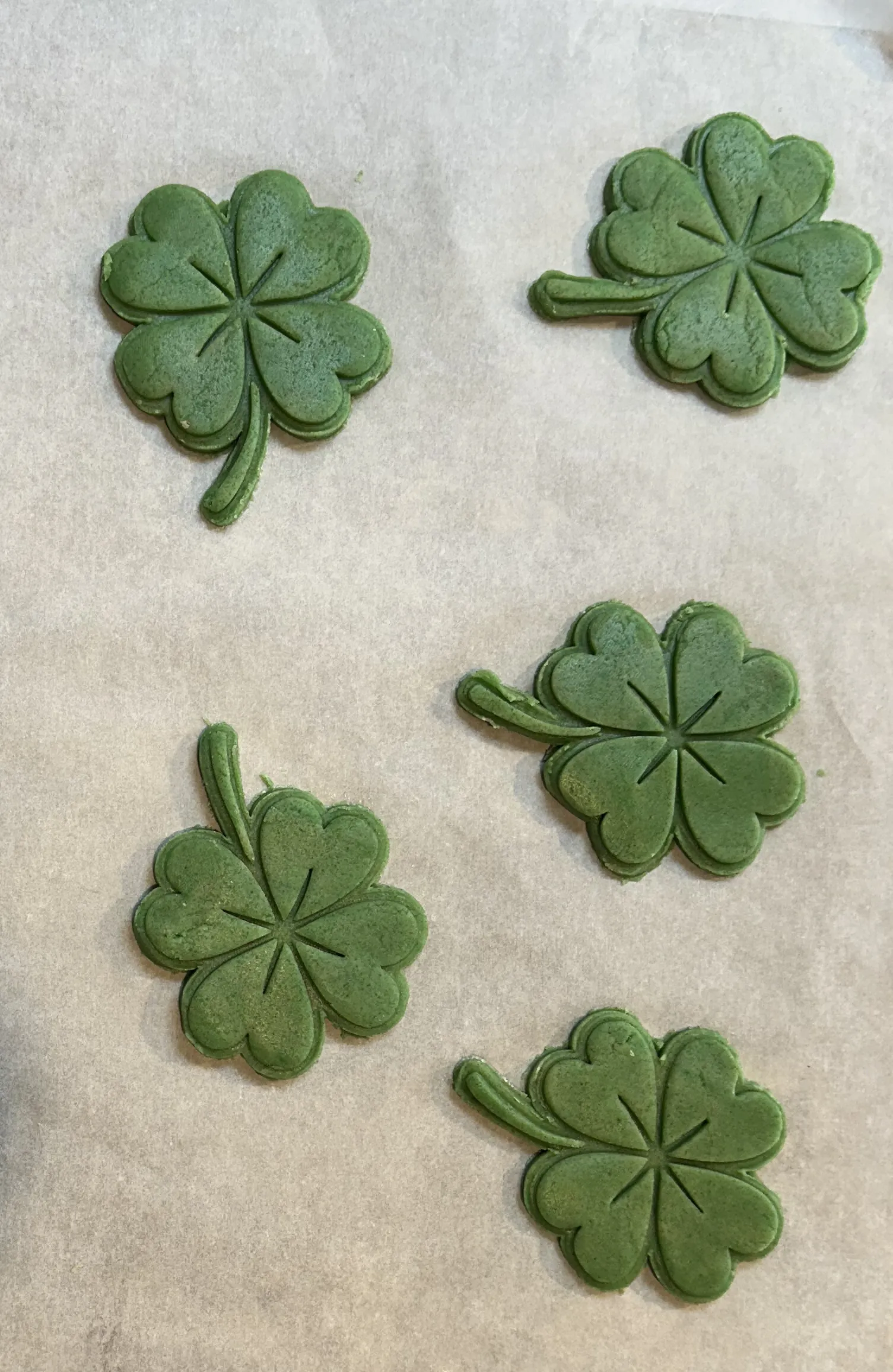 Stamped shamrock cookies before baking
