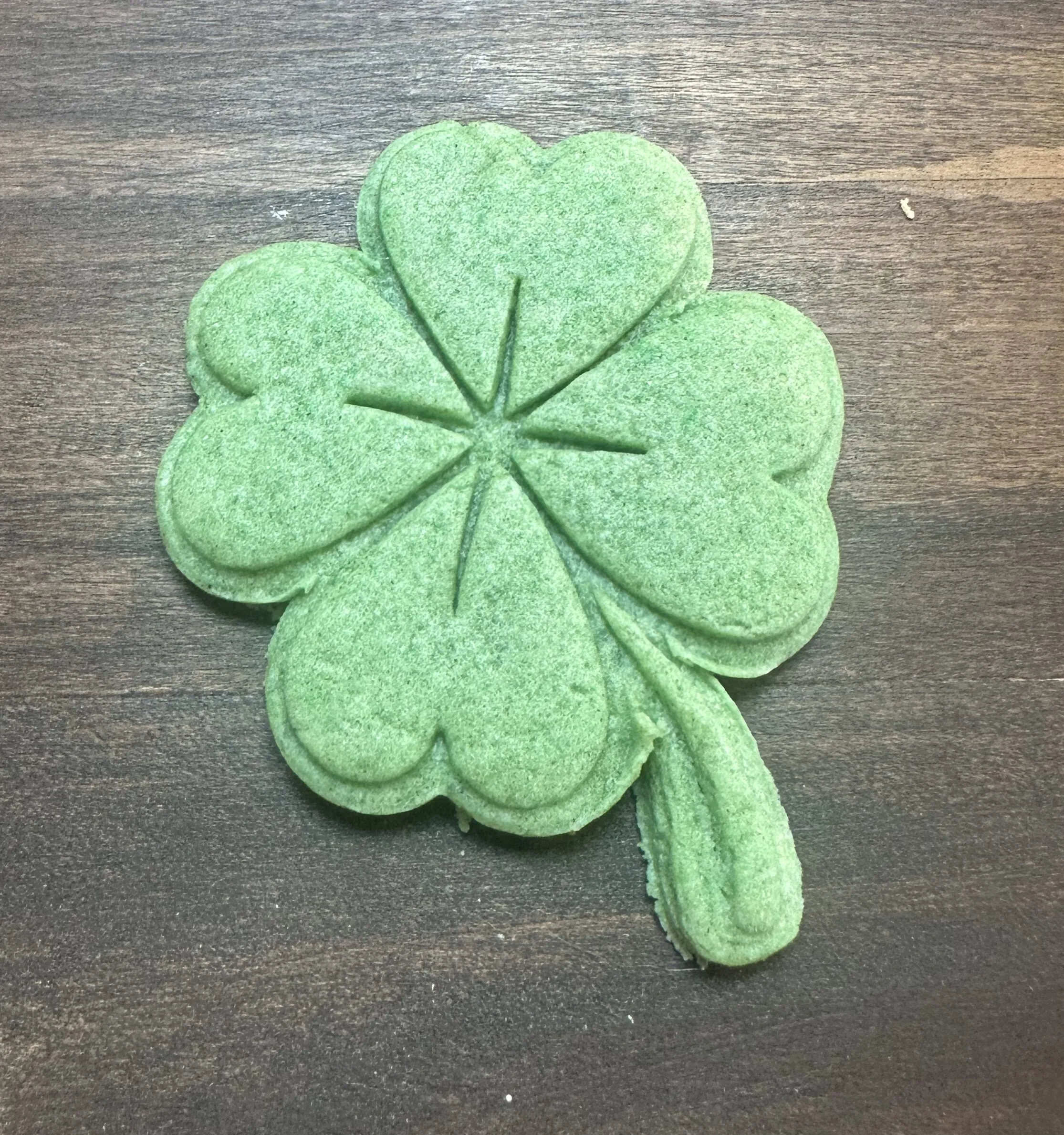 Green dyed stamped shamrock cookie
