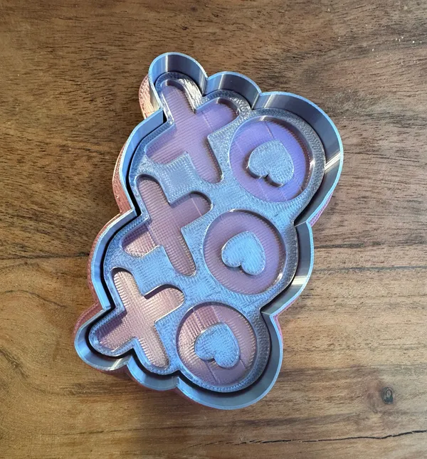 Multi-depth cookie stamp showing three-tier XO design with varying impression depths